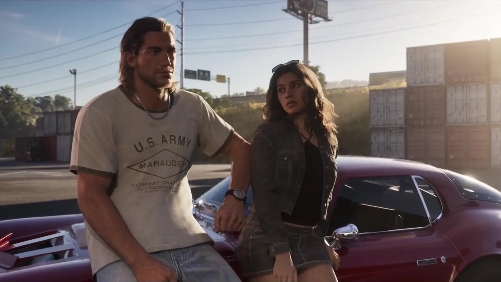 Launch Trailer frame: Jason, in a U.S. Army Marauder Combat Training School t-shirt, leaning on a red sports car next to Lucia in a denim jacket, in front of stacked shipping containers