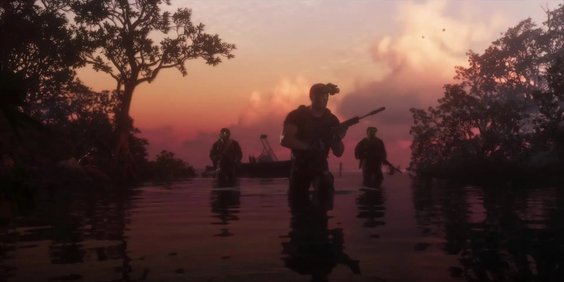 Three armed men wading through mangroves at sunset