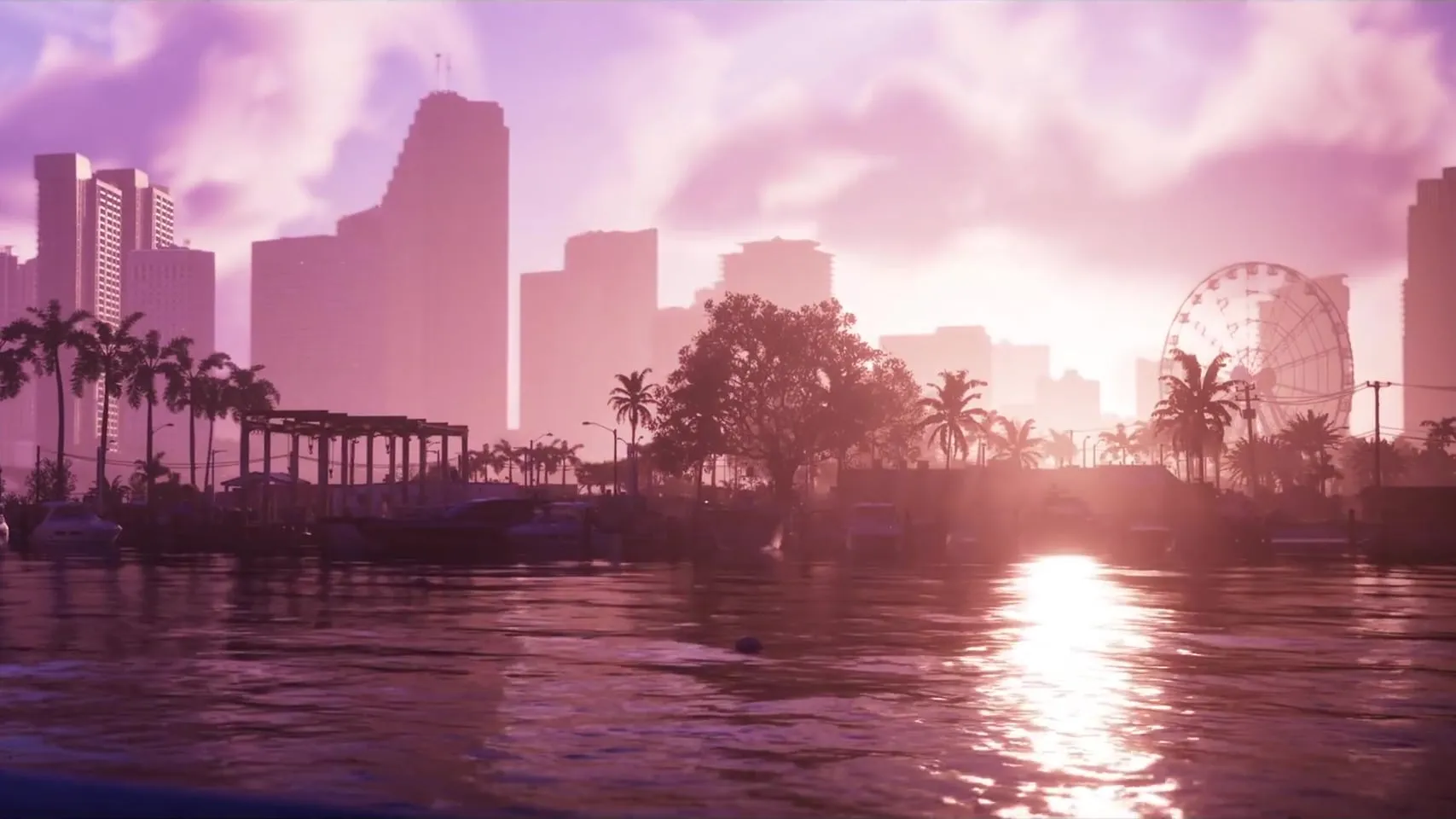 Launch Trailer frame: the Vice City skyline backlit at sunset, with palm trees, a Ferris wheel and the sun reflected on the water