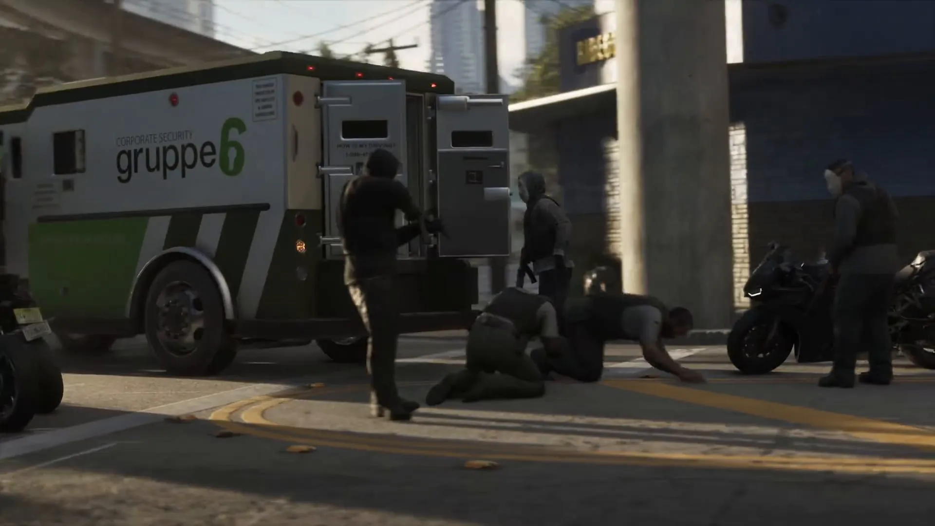 The white and green armoured van with Gruppe 6 Corporate Security on the side, open, with guards on the ground and armed robbers around it