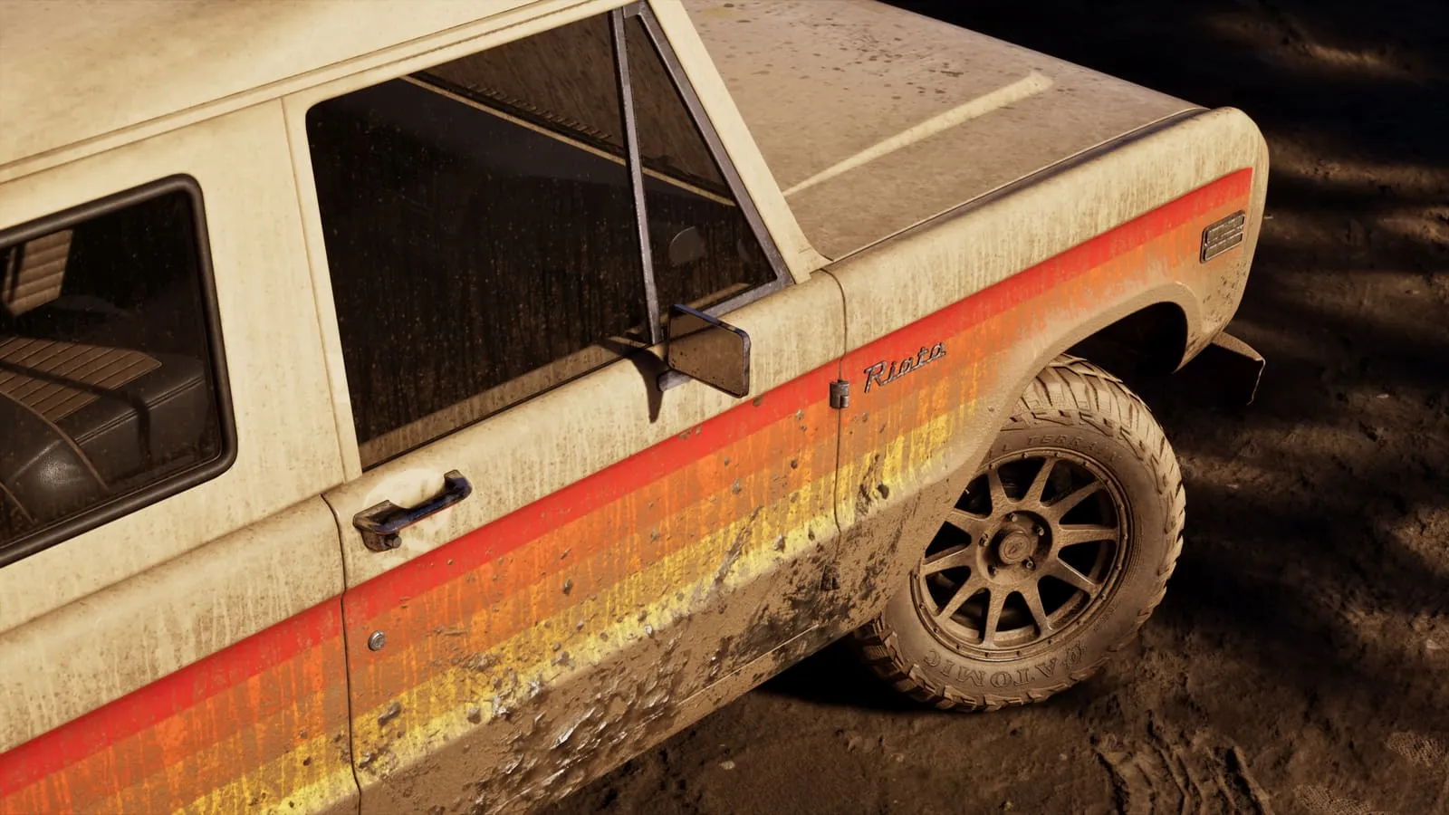 A beige off-roader with red, orange and yellow stripes, and the Riata script on the fender